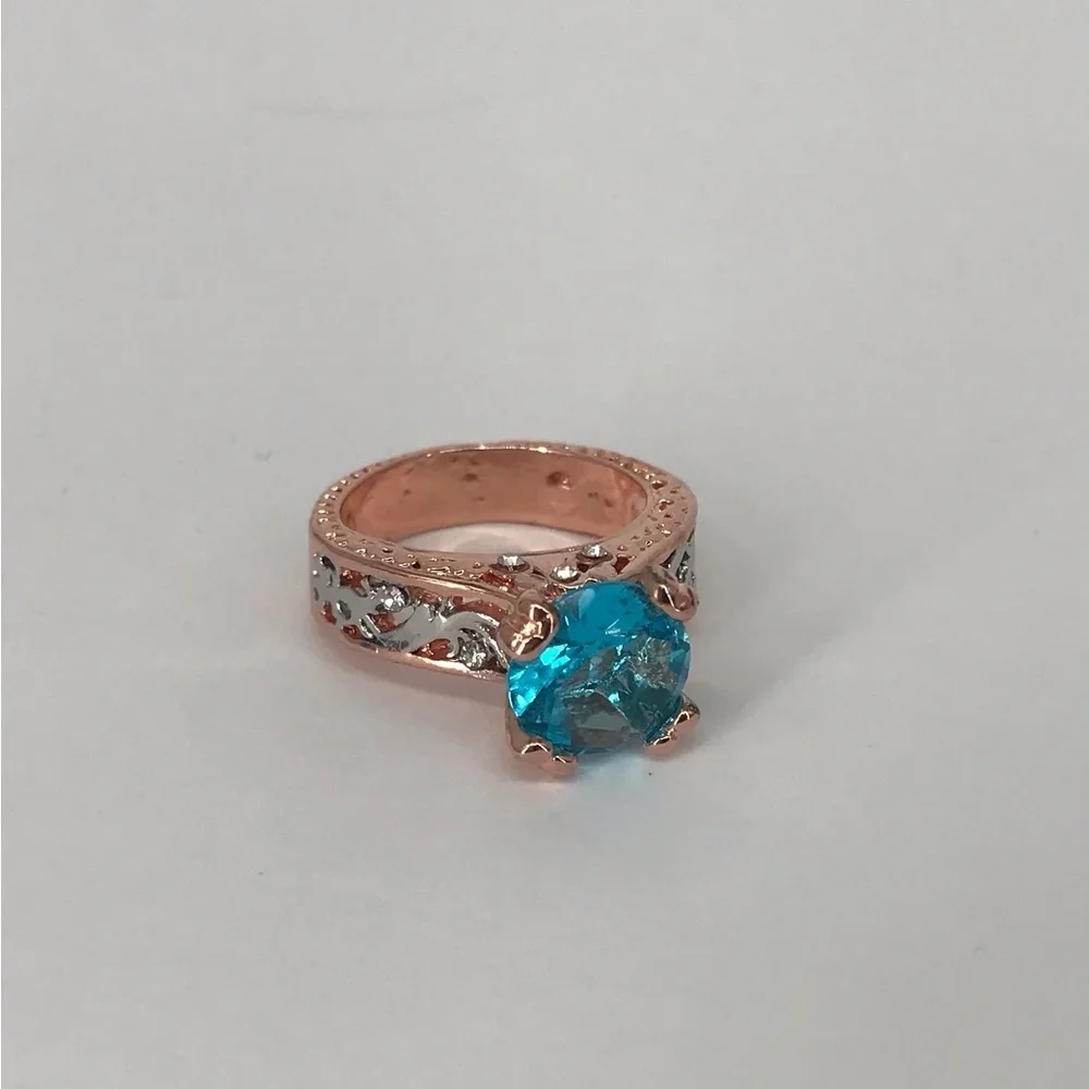 Mixed Metal Solitaire Ring with Blue Stone